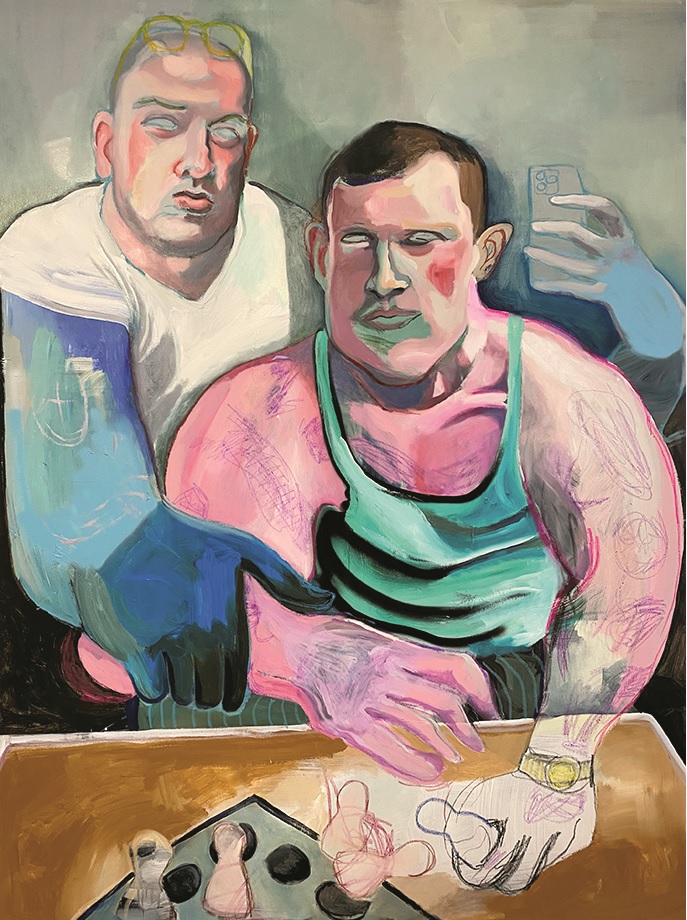 Two muscular men pose in an artistic style, one holding a smartphone, with figurines laid out on the table.