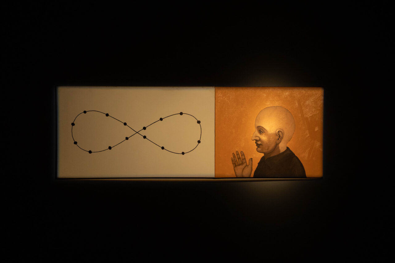 Artwork featuring an infinity loop and a portrait of a smiling man against a golden background.