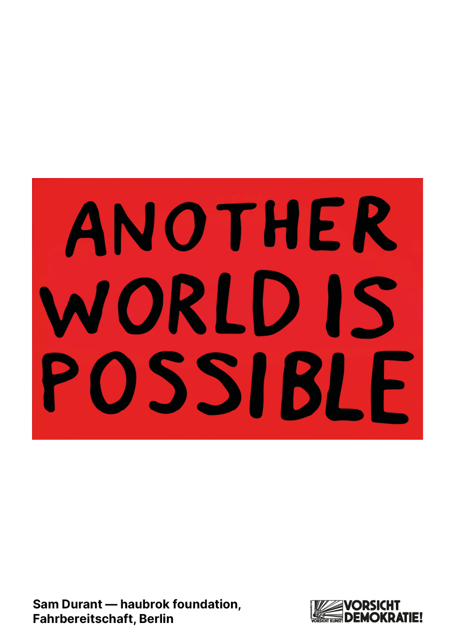 Rotes Plakat mit dem Text "ANOTHER WORLD IS POSSIBLE" in fetter schwarzer Schrift, pr&auml;sentiert von der haubrok foundation.