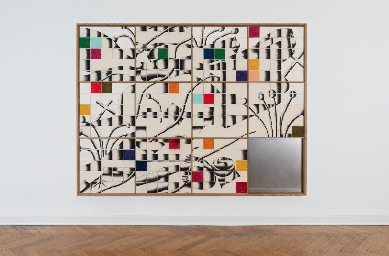 Abstract wall installation with geometric patterns and colors on tiles, combined with a stainless steel section.